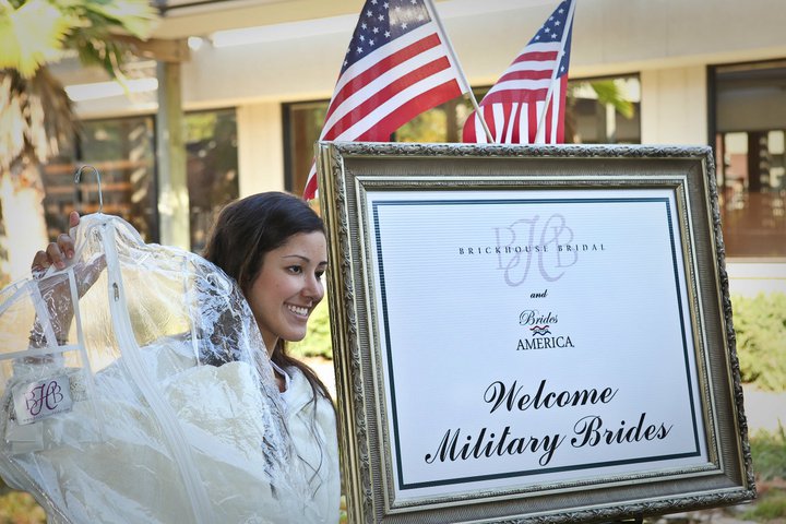 A bride collects her gown from a Brides Across America event at Brickhouse Bridal in Houston {source}