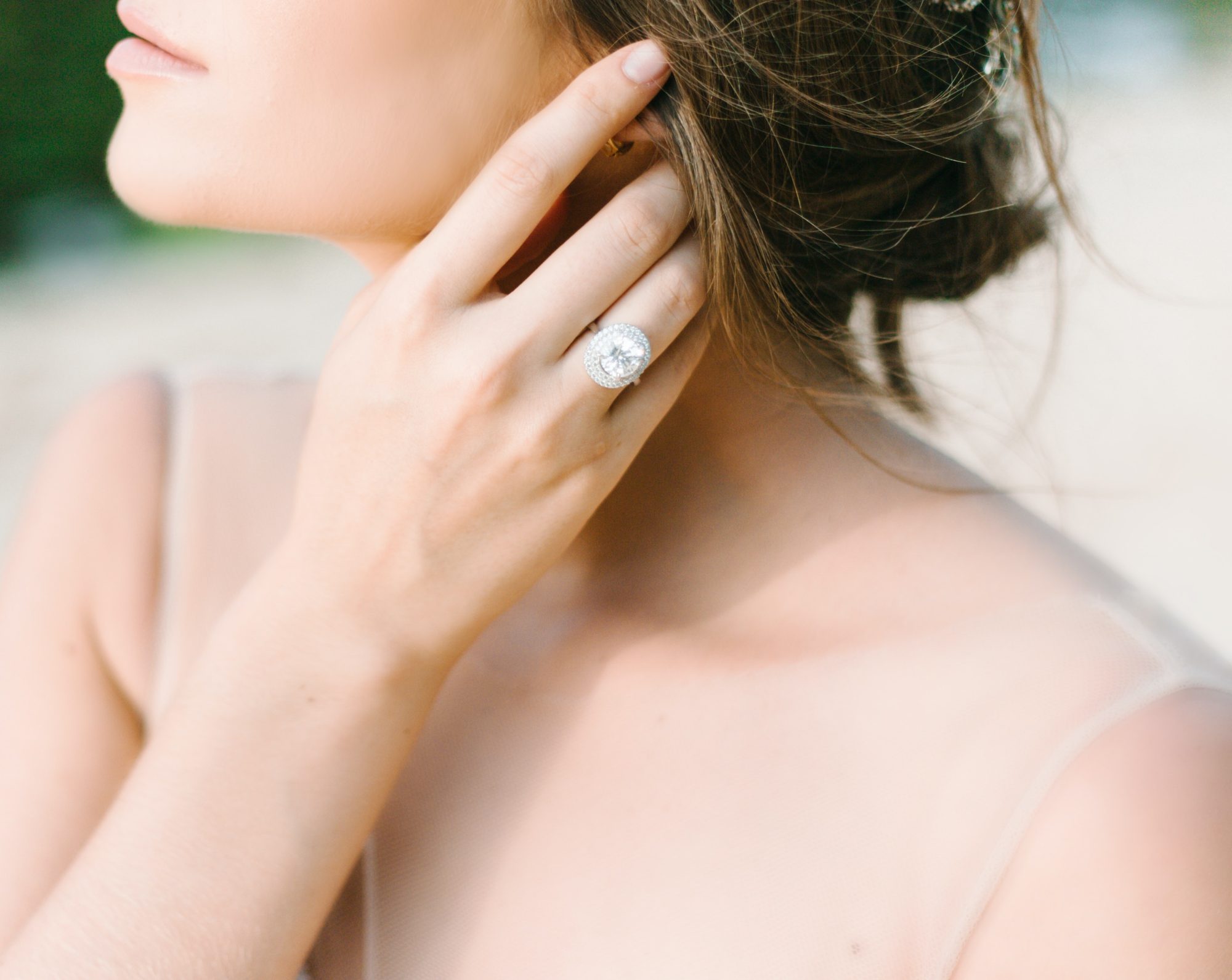 Closeup of bride with engagement ring