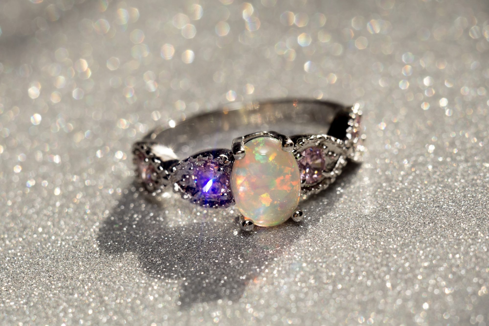 An opal ring with amethysts on each side