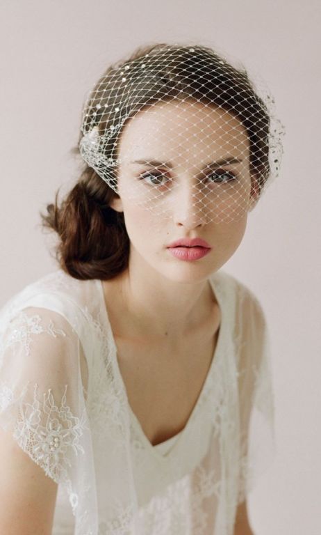Bride wearing birdcage veil