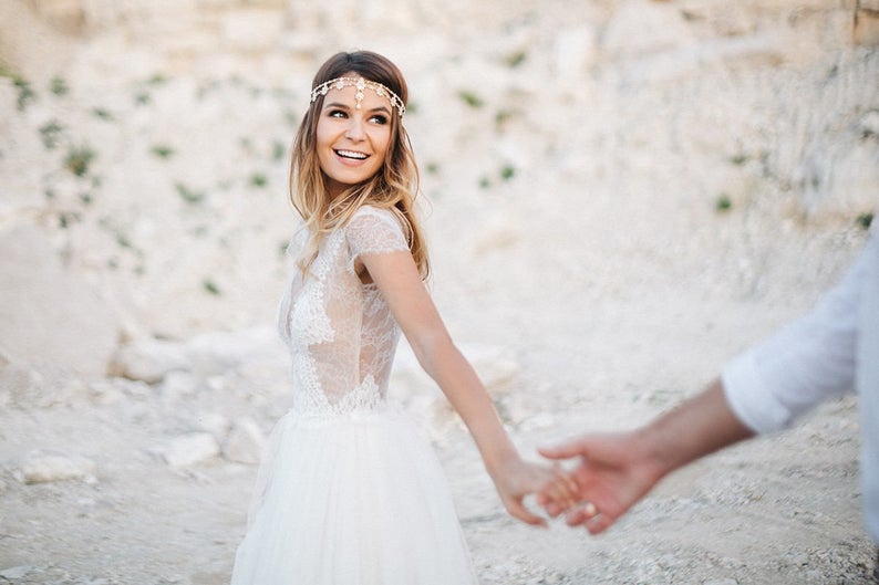 Bride wearing hairchain during photoshoot