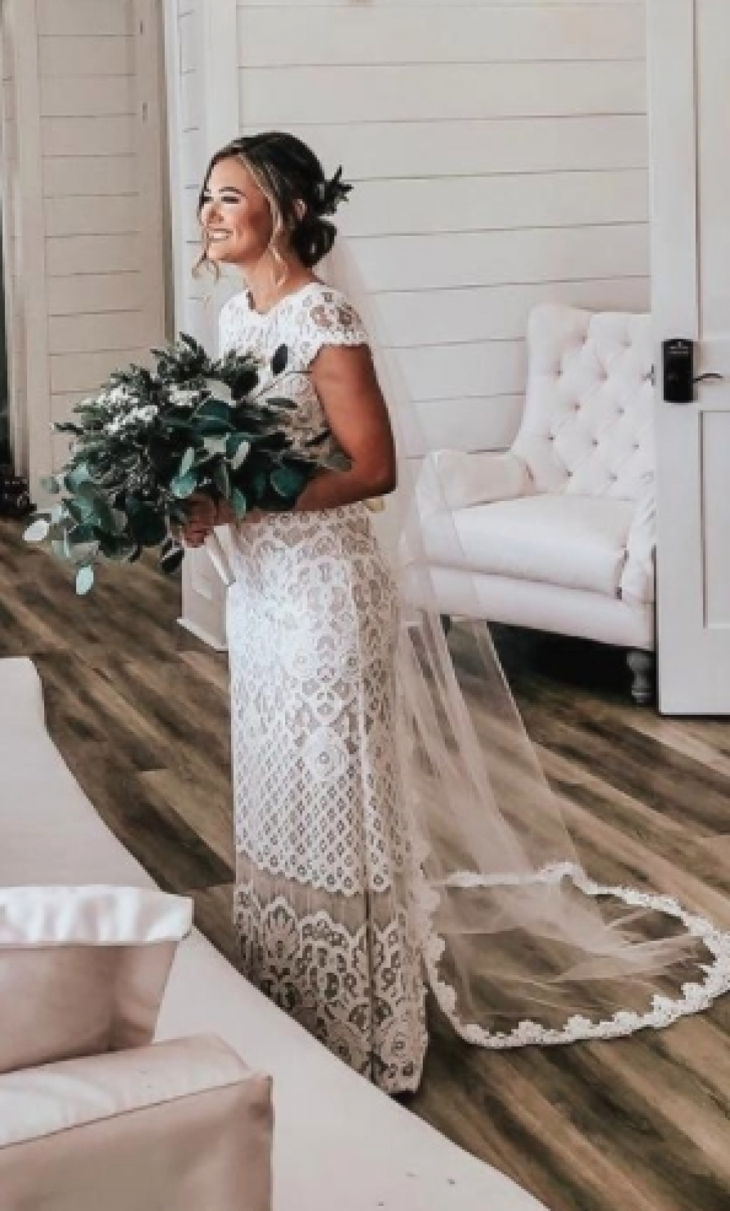 Bride wearing chapel length veil