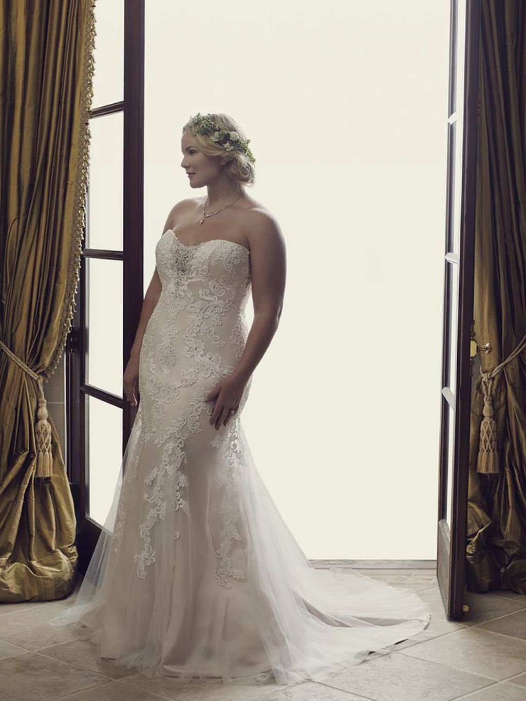 Plus size bride wearing fit-and-flare wedding dress - the Casablanca Lotus gown
