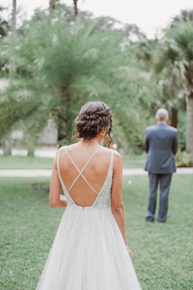 bride wearing Glamorous a-line wedding dress with criss-cross beaded back straps