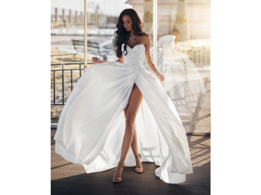bride wearing simple A-line wedding dress with high-slit in skirt