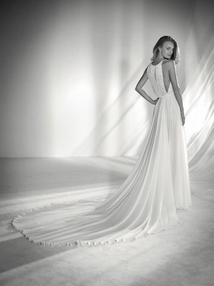 Ultra-glam soft A-line wedding dress with flowy skirt and beaded fringe bodice by Pronovias