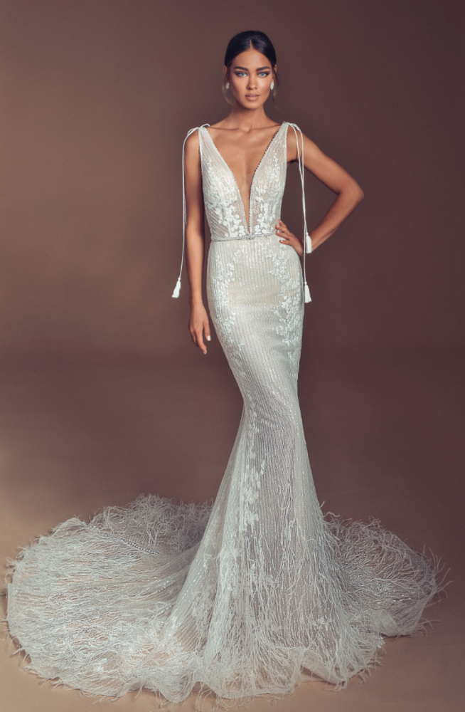 Couture mermaid wedding dress with ostrich feather skirt and train