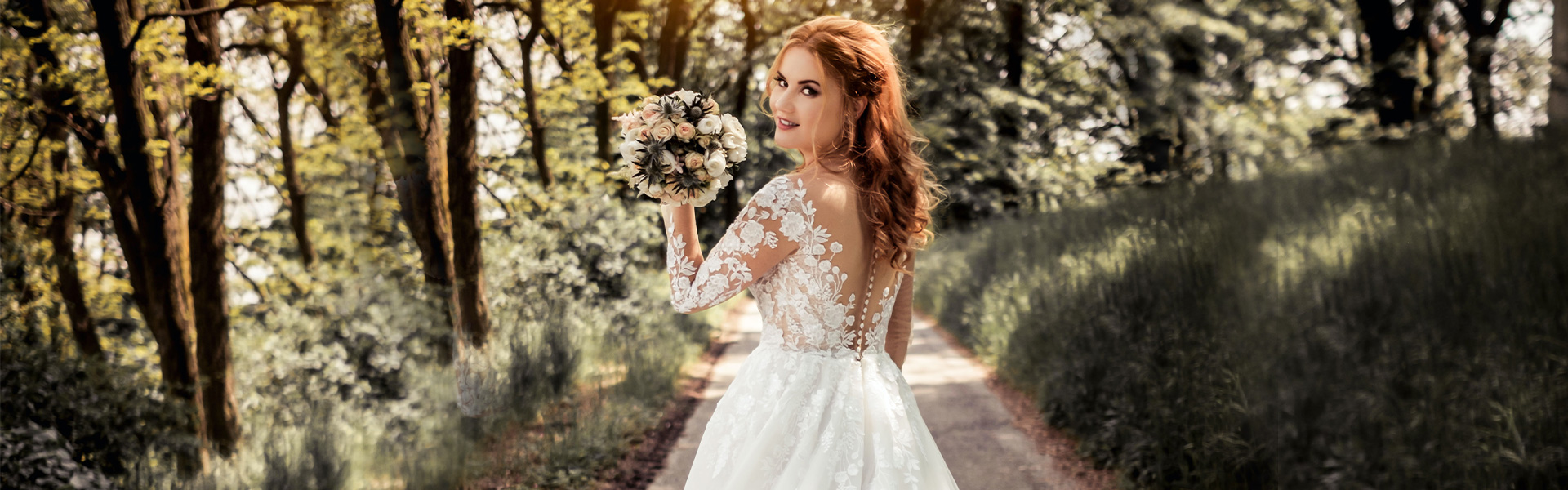 Gorgeous bride walking through forest with classic waistline