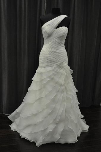 Elegant one should strap dress displayed on a mannequin