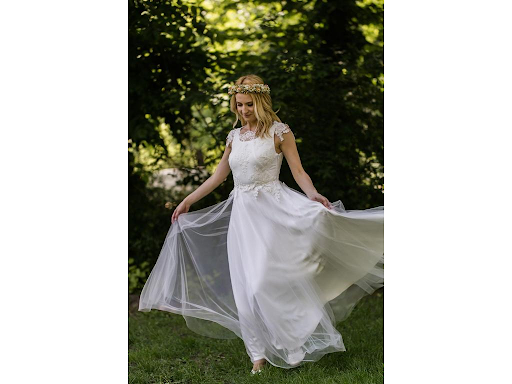 Bride spinning in flowy wedding dress