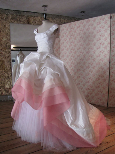 White and pink wedding dress on mannequin