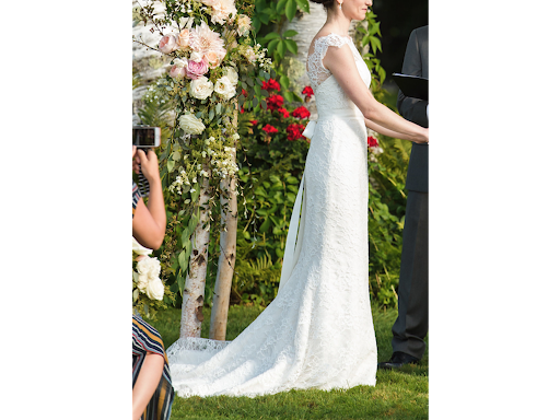 Bride standing in flowy dress during ceremony