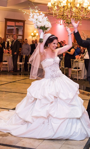 Bride dancing on dance floor of her wedding