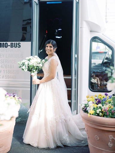 Gorgeous bride about to take bus after her wedding