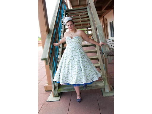 Bride walking down stairs in her tea length dress