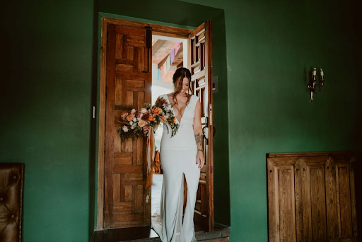 Bride showing off sleek and simple wedding dress