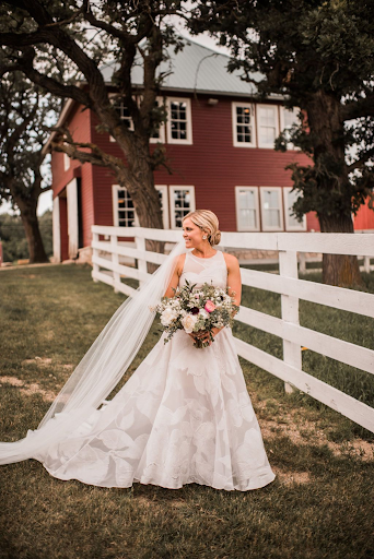 Bride wearing gorgeous gown at rustic farm wedding
