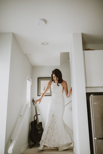 Bride walking down the stairs after getting ready for her wedding