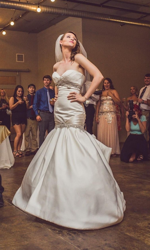 Bride dancing in strapless gown on the dance floor