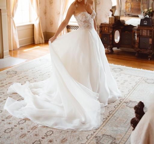 Bride twirling in gorgeous strapless wedding dress