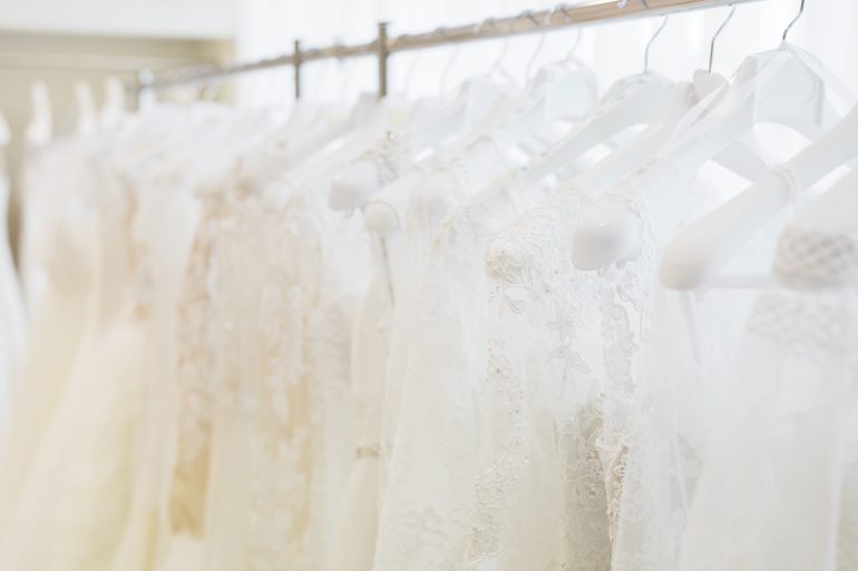 Variety of wedding dresses on a rack