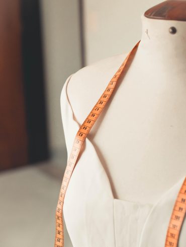 Mannequin with measuring tape around neck