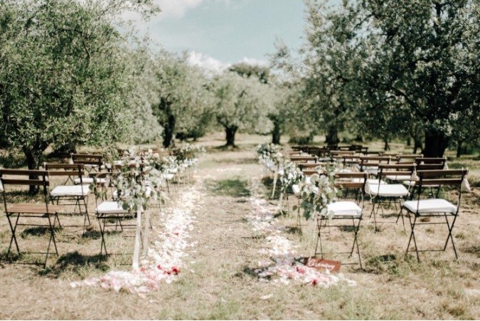 Neutral and organic rustic farm wedding in Tuscany.