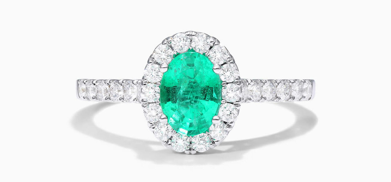 18K White gold oval halo emerald and diamond ring