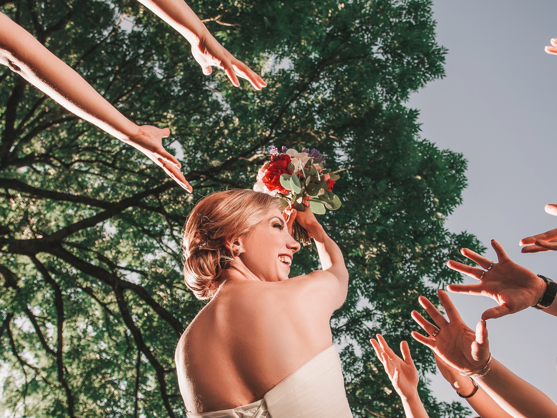 Bride tossing the bridal bouquet