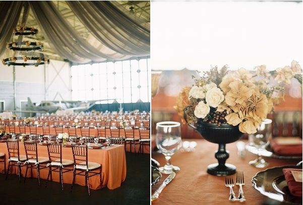 airplane-hanger-wedding-reception-venue-centerpiece-decor-flowers-coral-beige-tables