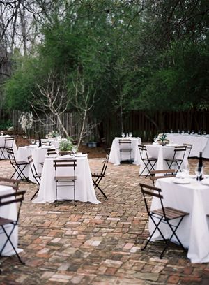 dad-made-reclaimed-brick-patio-terrace-for-backyard-wedding-reception-bistro-tables-cafe-chairs
