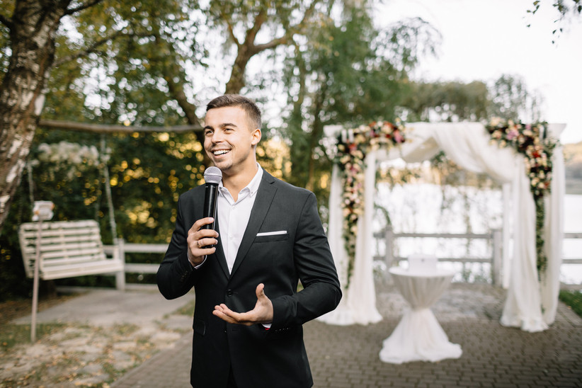 Man giving speech at an outdoor wedding