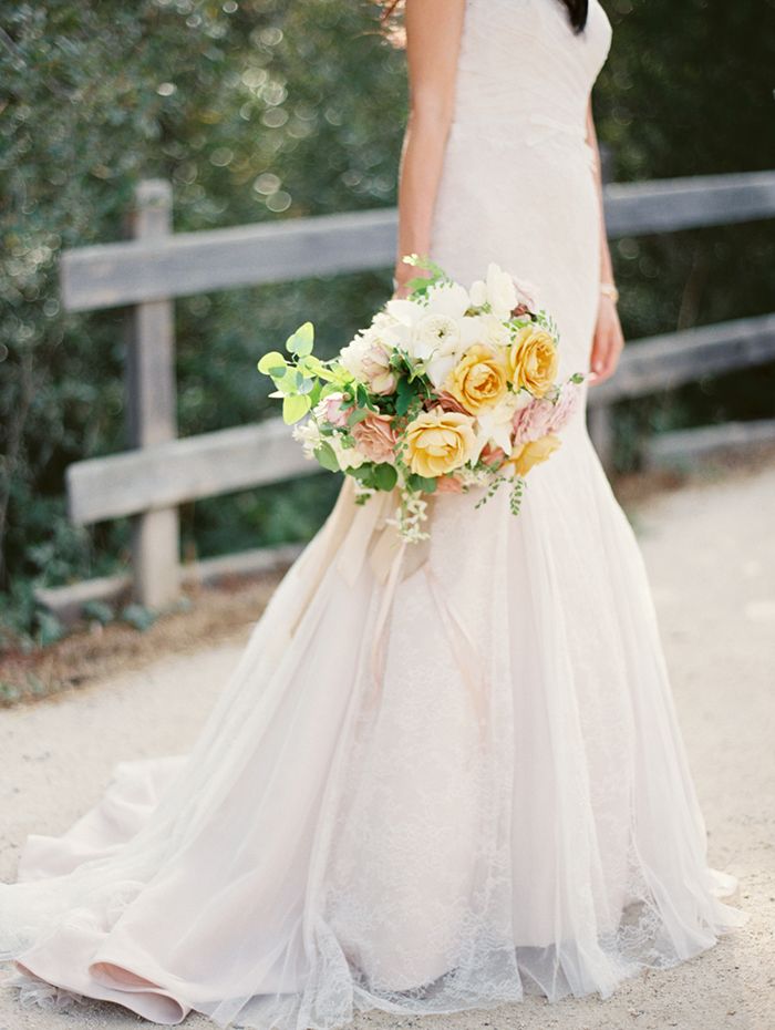 23-mermaid-wedding-gown-yellow-bouquet