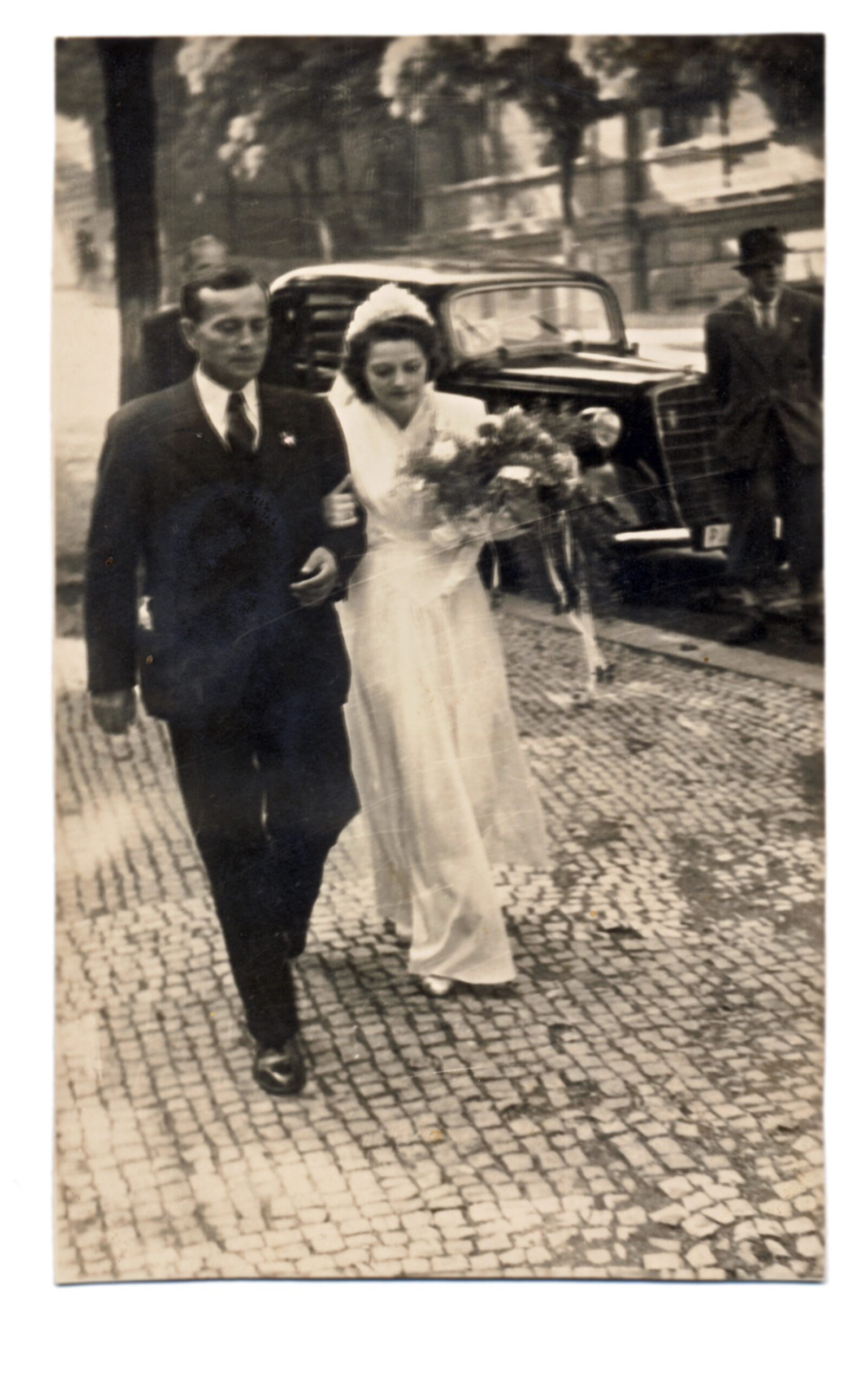 1950's bride walking with groom on street