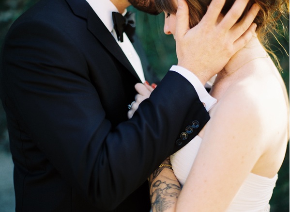 bride-groom-forehead-kiss-outdoors-charleston