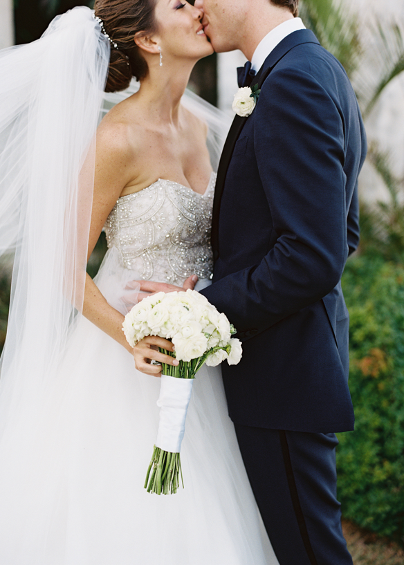 eric-kelley-wedding-BadgleyMishka-dress-kiss-white-bouquet