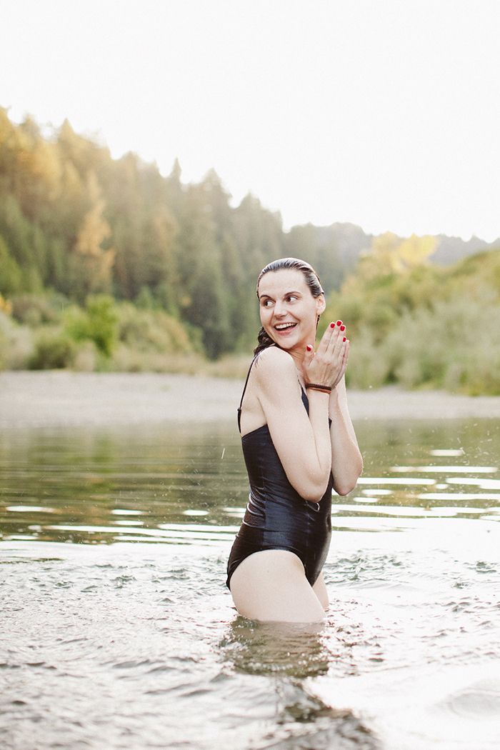 9-black-swimsuit-river-floating-christina-mcneill