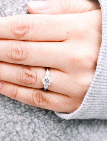 round diamond ring on finger