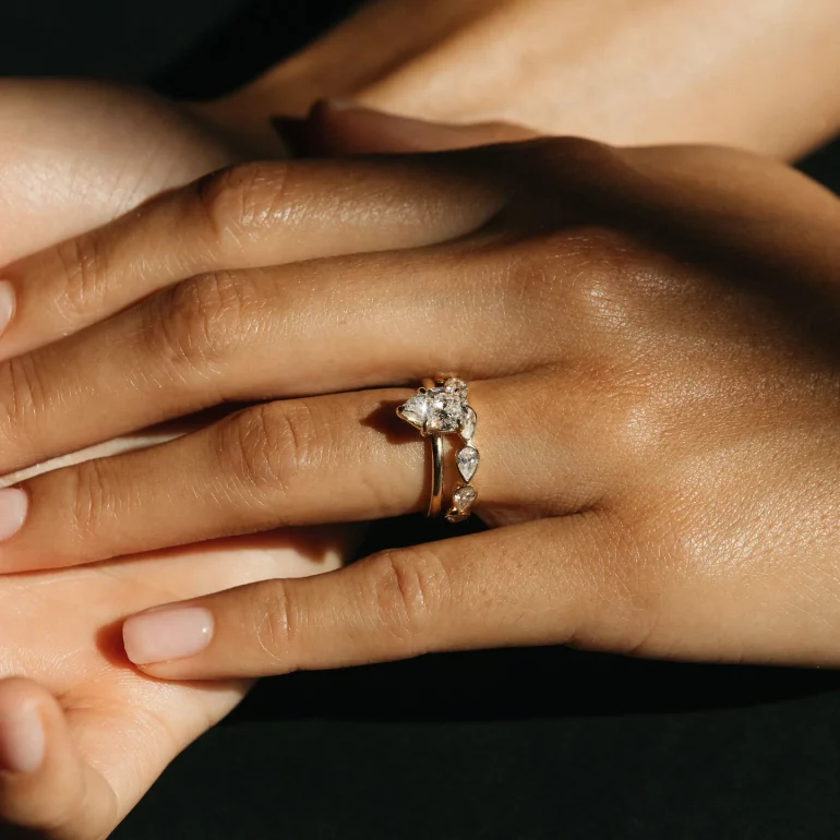 stacked wedding bands on finger